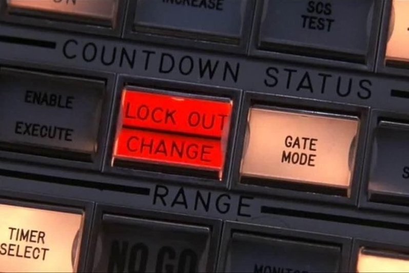 closeup of 1970s illuminated buttons on a computer station
